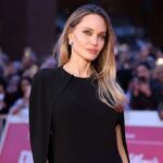 Angelina Jolie shows off new ink in daring black dress